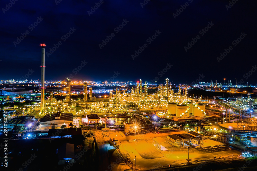 Aerial view. Oil refinery factory and oil storage tank at twilight and night Aerial view. Oil refinery factory and oil storage tank at twilight and night