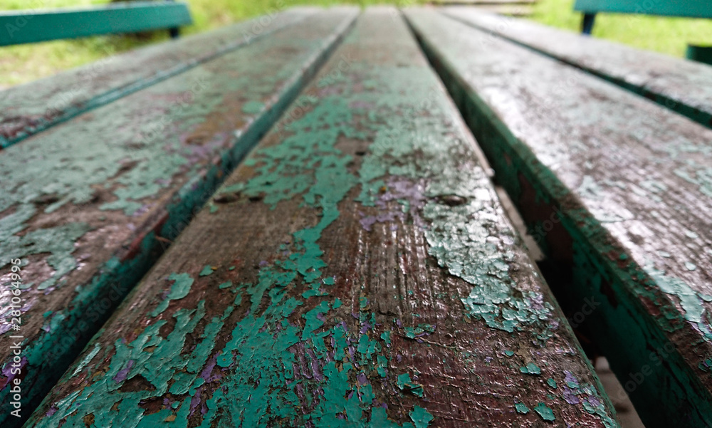 Old wooden bench with peeling paint closeup. Old wooden bench with peeling paint closeup.