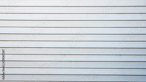 The wall of a typical American house painted with white paint. Authentic texture
