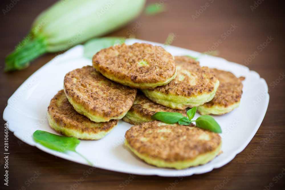 vegetable fritters made from green zucchini in a plate vegetable fritters made from green zucchini in a plate
