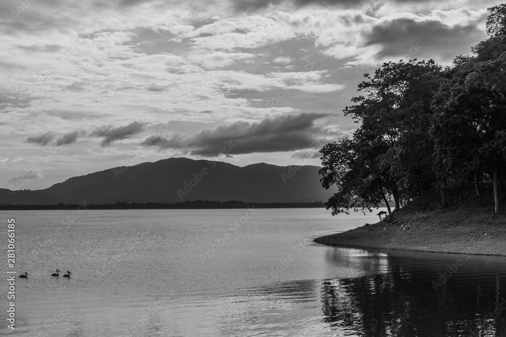 silhouette of mountain on the water, black and white image