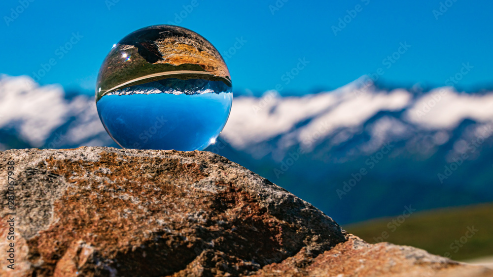 Crystal ball alpine landscape shot at Wildkogel Arena, Neukirchen, Salzburg, Austria