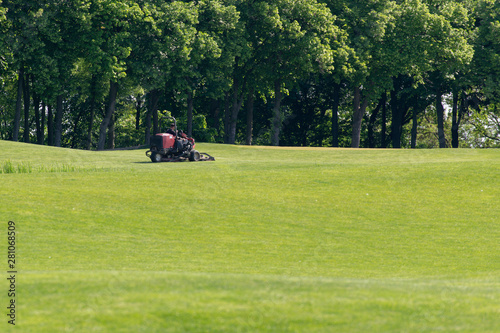Professional lawn mower cuts the grass