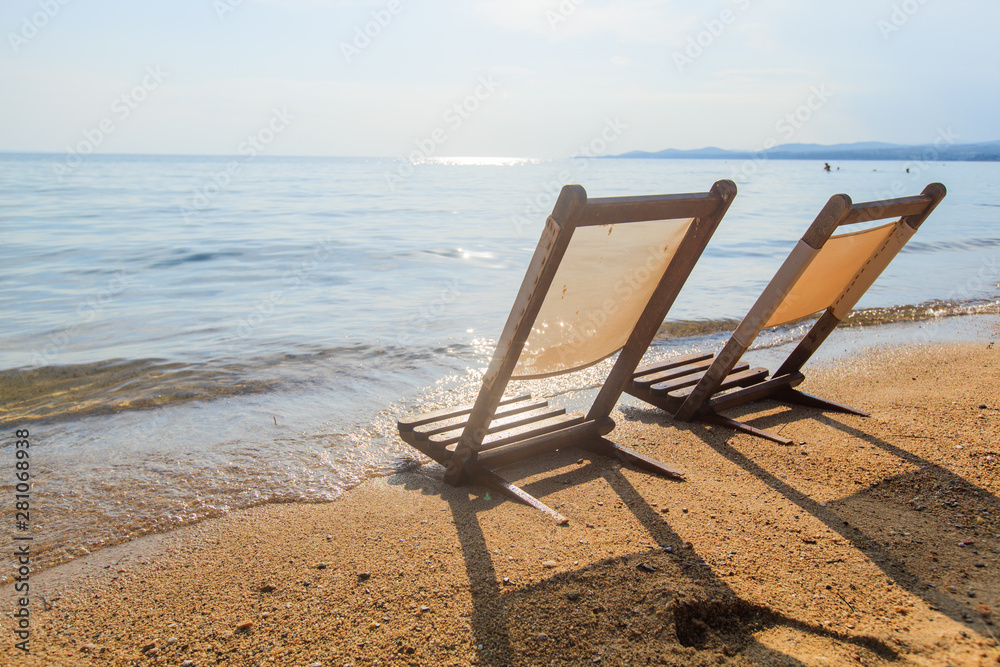 Summer holiday and travel beach chair on sand