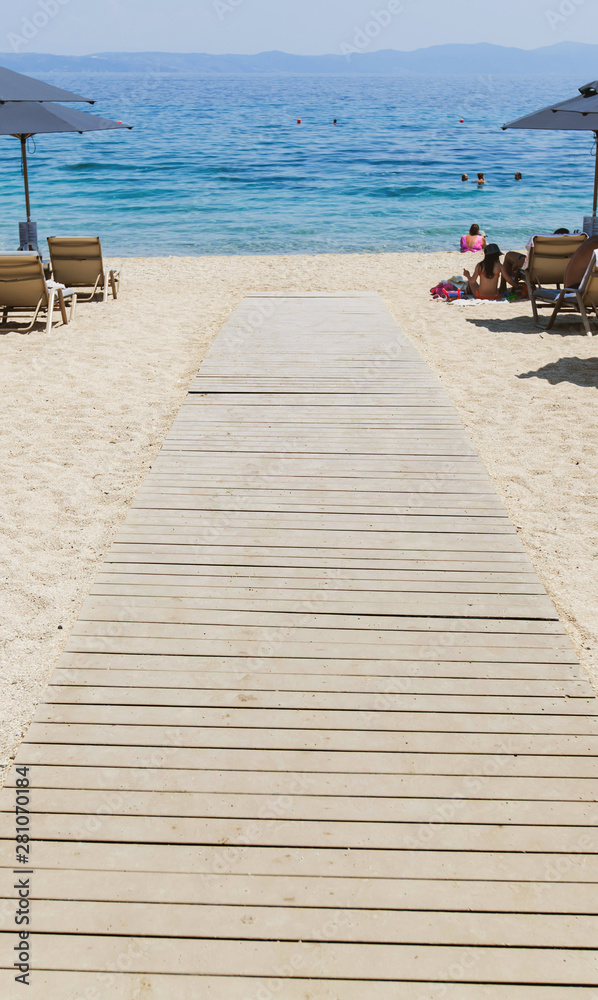 Wooden path on sand beach summer seascape