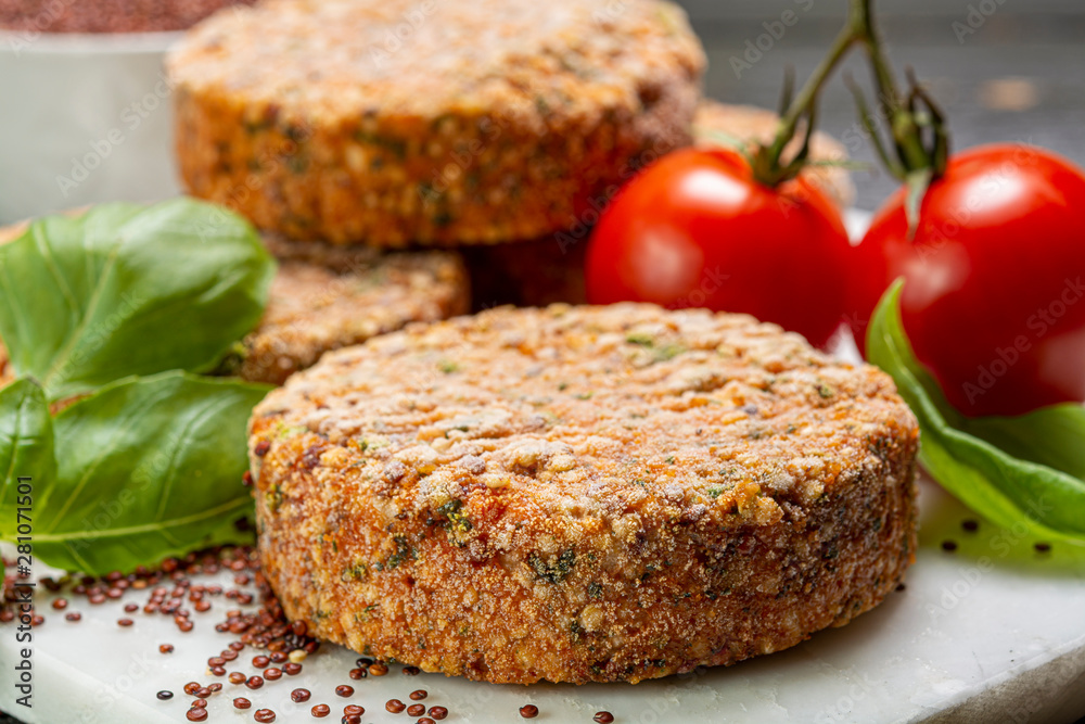 Tasty vegetarian burgers made from healthy quinoa, basil, tomatoes and mozzarella cheese