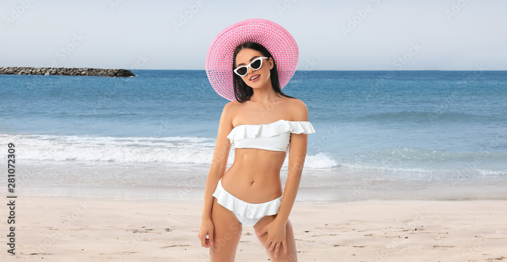 Picturesque view of beautiful beach with stone breakwater on sunny day Picturesque view of beautiful beach with stone breakwater on sunny day