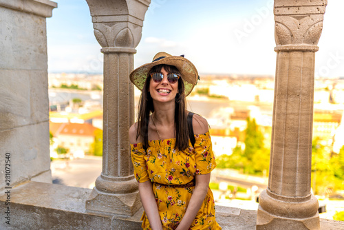 A happy young woman enjoying her trip to the Castle of Budapest