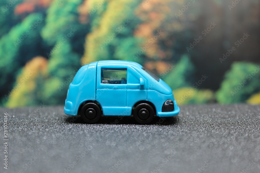 blue toy car on the road