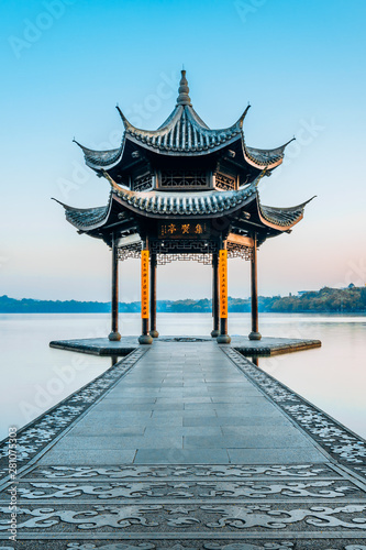 Jixian pavilion during sunrise in Hangzhou  Zhejiang province  China with all Chinese words on it only introduces itself which means  Jixian Pavilion  without advertisement.