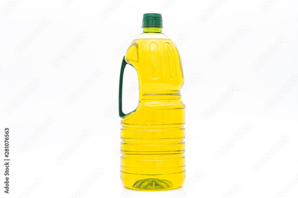 A bottle of yellow salad oil on a white background A bottle of yellow salad oil on a white background