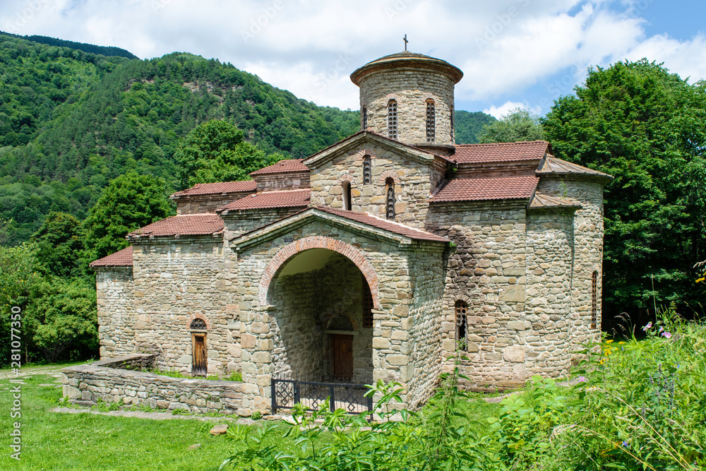 10th century ancient Christian church, Nizhnearhizy temples, Northern Zelenchuk temple, stone temple among mountains and vegetation