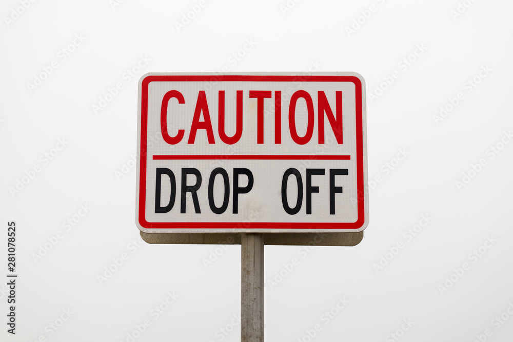 Warning in the Economy or Stock Market Cryptocurrency Bitcoin Matket Collapse Concept Symbol Represented by a Road Warning Sign Caution Drop Off Warning in the Economy or Stock Market Cryptocurrency Bitcoin Matket Collapse Concept Symbol Represented by a Road Warning Sign Caution Drop Off
