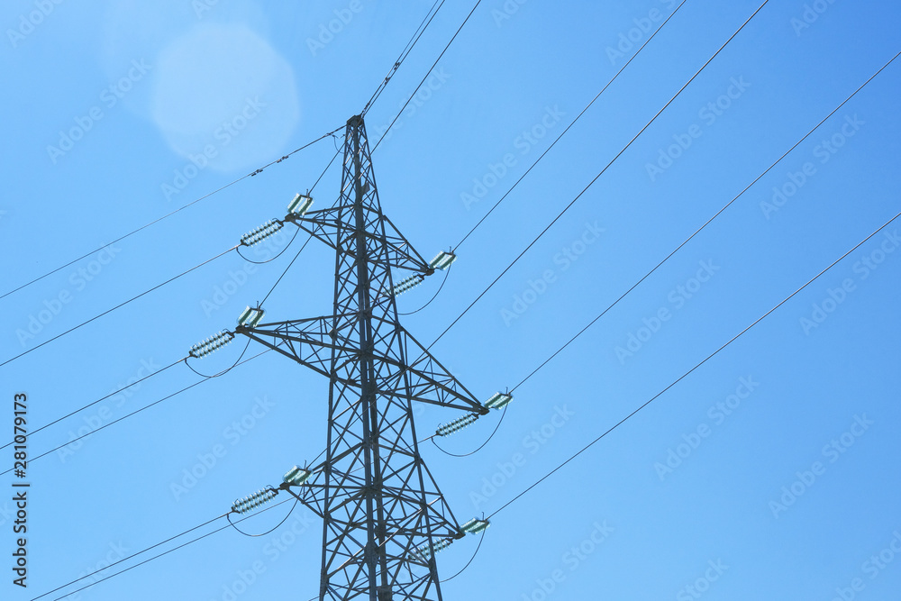 Transmission line of electricity. Electric wire electric tower. High voltage electricity pole on sky background. Sunlight. Transmission line of electricity. Electric wire electric tower. High voltage electricity pole on sky background. Sunlight.