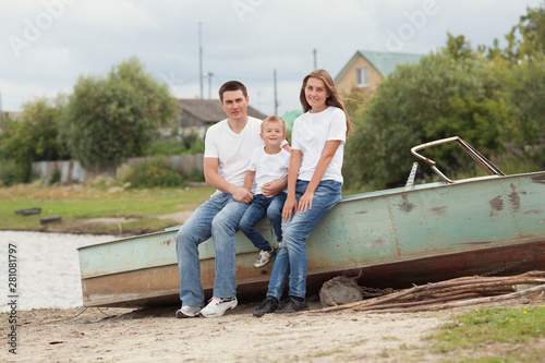 Portrait of Happy Family. Father with two children in countryside outdoors