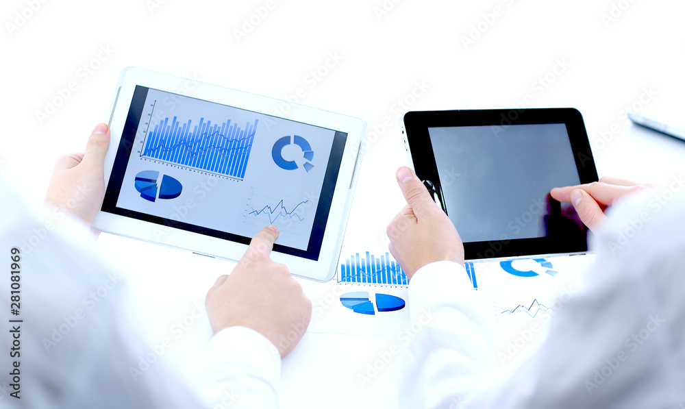 close up.businessman pointing with pen on a digital tablet screen.