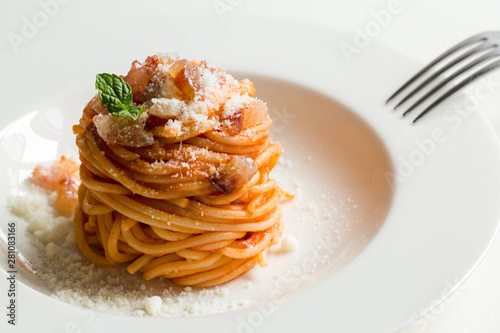 Homemade Amatriciana - Italian pasta based on guanciale (cured pork cheek), pecorino cheese, tomato, white wine, olive oil. Cucina romana tradizionale. Original recipe fixed by Comune di Amatrice. photo