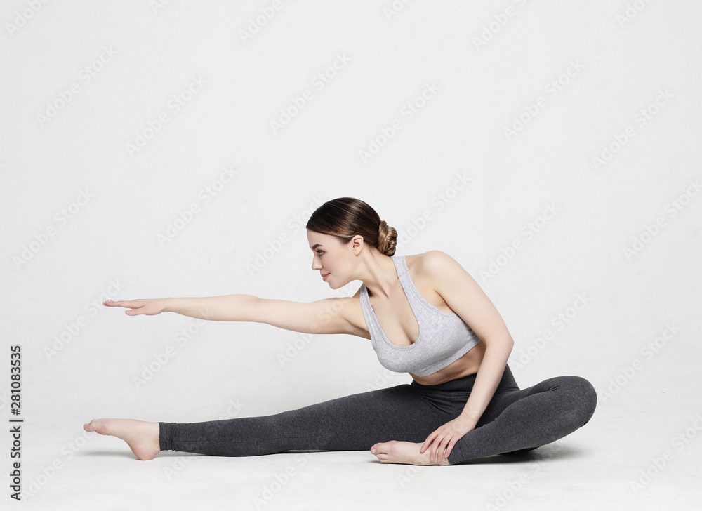 Portrait of attractive woman doing yoga, pilates. Healthy lifestyle and sports concept.