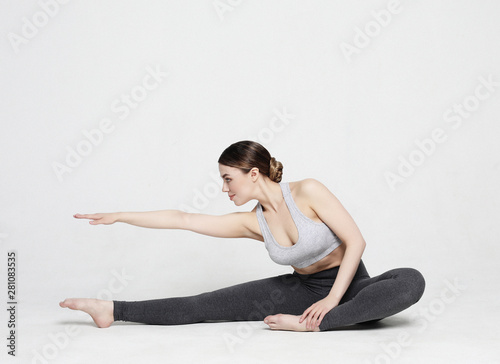 Portrait of attractive woman doing yoga, pilates. Healthy lifestyle and sports concept.