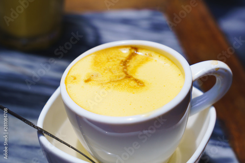 Vietnamese egg coffee hot and cool in the white coffee mug, cup in HANOI VIETNAM