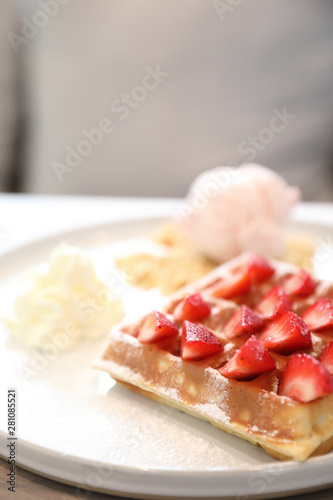 Strawberry waffle with ice cream , dessert on wood background