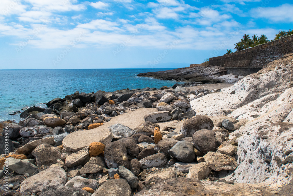 Landscape with blue turquoise water and many rocks in Tenerife Spain.