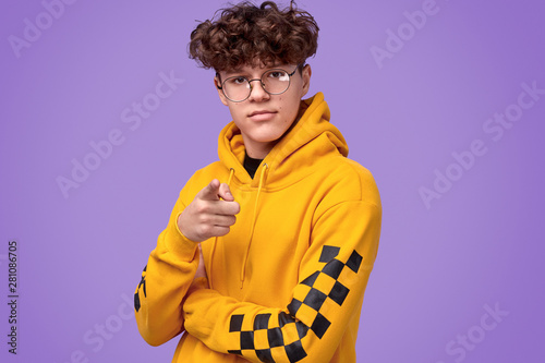 Confident teenager pointing at camera