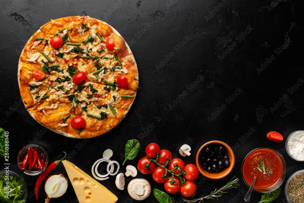 Delicious pizza with tomatoes and herbs on black table