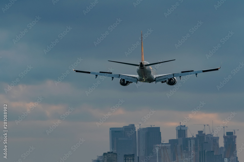 Unidentified Private medium range twin-engine jet plane flying above mystery city in beautiful moon light night Unidentified Private medium range twin-engine jet plane flying above mystery city in beautiful moon light night