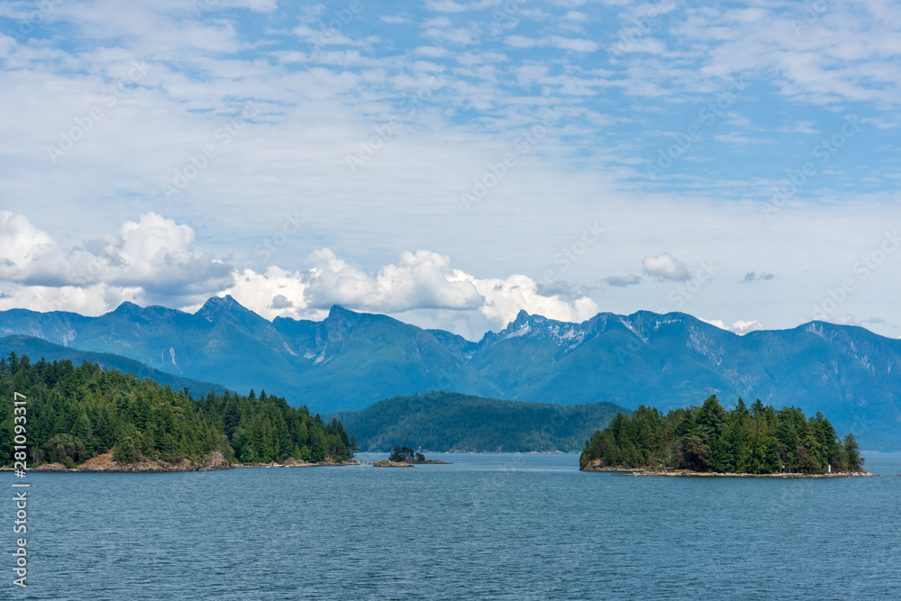 View over Inlet, ocean and island with mountains in beautiful British Columbia. Canada.