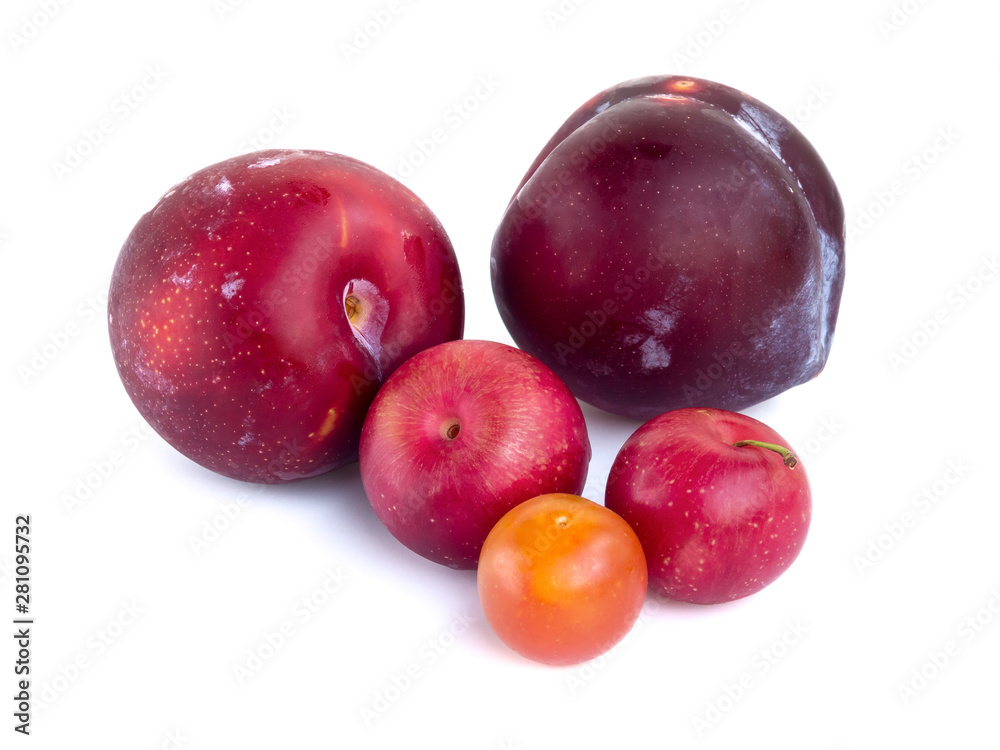 A few plums of different varieties isolated on white background