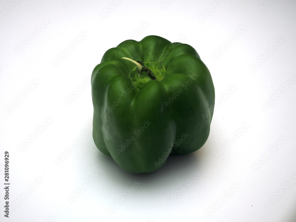 Large green fruit of sweet pepper. Photo on a white background. Large green fruit of sweet pepper. Photo on a white background.