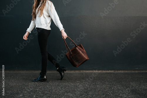Woman carrying bag photo