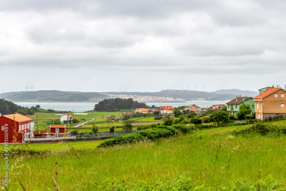 Overcast summer Cantabrian Sea coastline view with Merexo and Camarinas in the background on the Way of St. James, Camino de Santiago, Province of A Coruna, Galicia, Spain