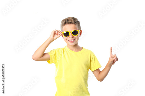Boy in yellow t-shirt with sunglasses isolated on white background