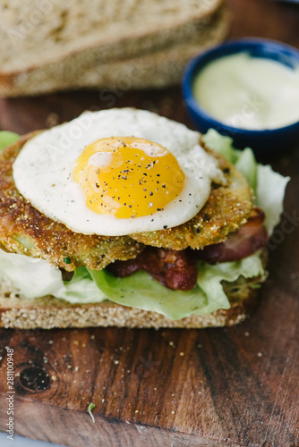 Fried green tomato BLT with a fried egg