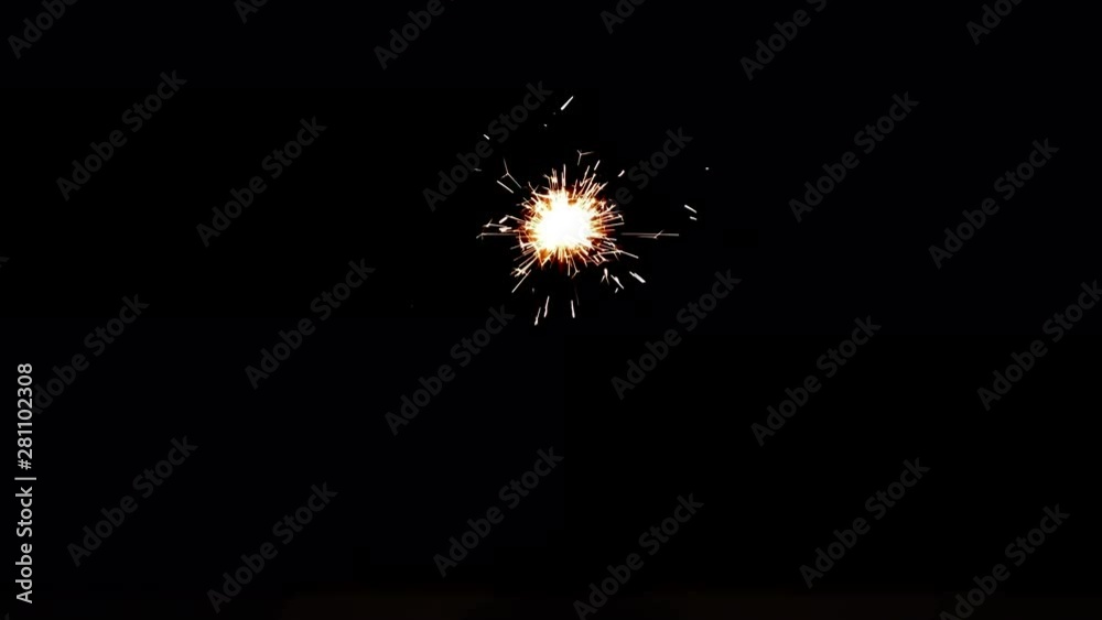 Slowed down video of burning sparkler in dark. Fiery bengal light on black background in 4k ultrahd (UHD) 3840x2160 Slowed down video of burning sparkler in dark. Fiery bengal light on black background in 4k ultrahd (UHD) 3840x2160