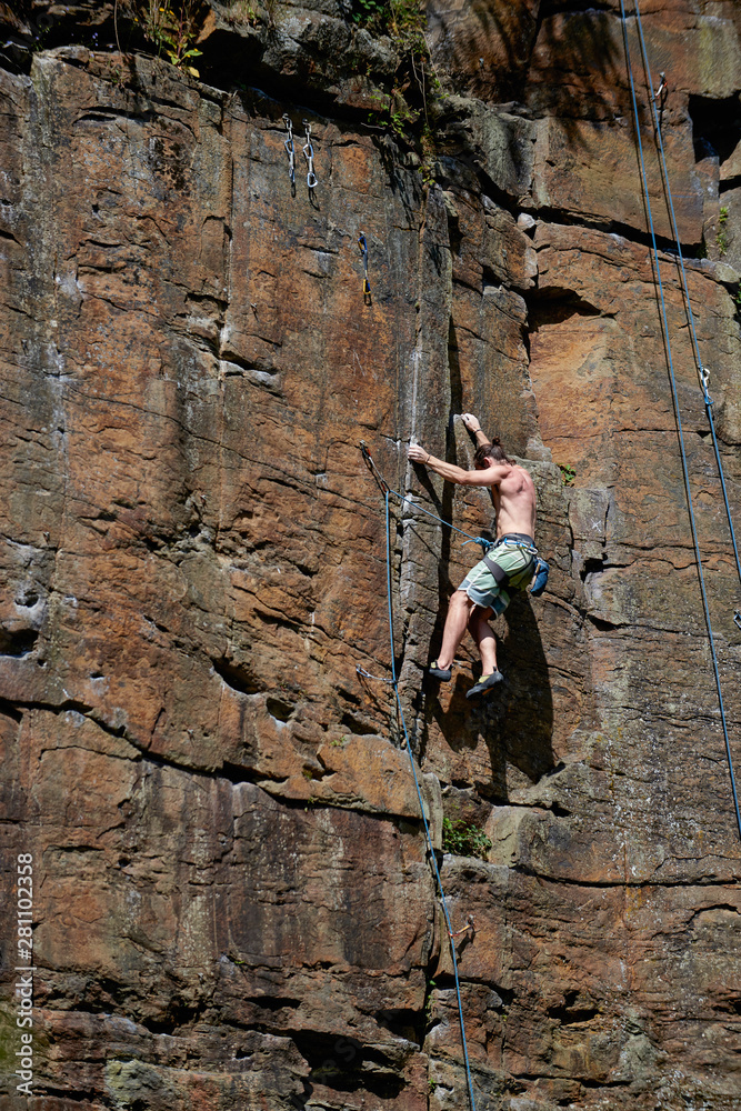 Rock climber climbing mountain Rock climber climbing mountain