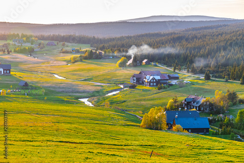 Jizerka village at sunset time. View from Bukovec Mountain, Jizera Mountains, Czech Republic photo