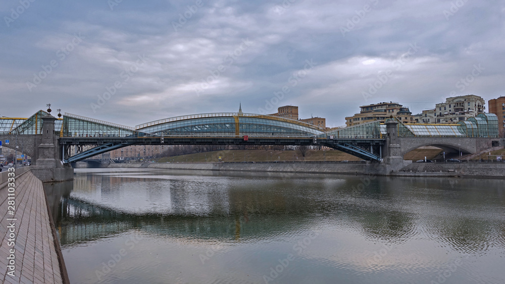 Reflection of the bridge of Bogdan Khmelnitsky in the water of the Moscow river