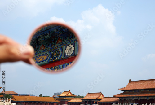 The details of the Forbidden City building are seen in the mirror. Forbidden City, Beijing, China. photo