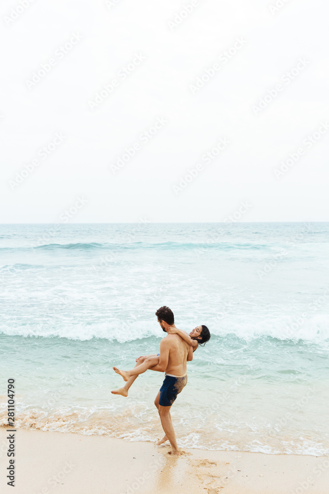 Couple On A Beach Having Fun On Vacation Couple On A Beach Having Fun On Vacation