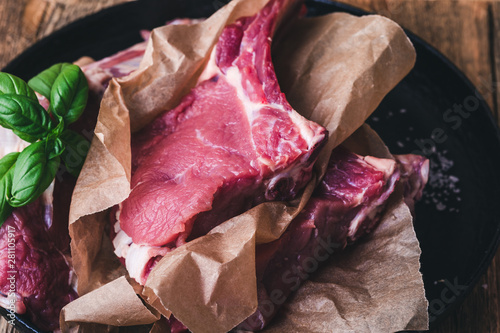 Raw veal steaks, preparing food