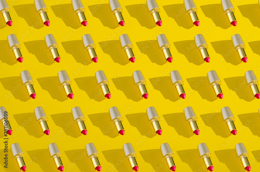 Fototapeta premium Collage red lipstick in gold tube on yellow background