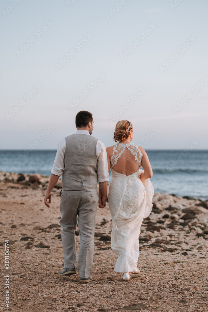 Wedding Couple Walking on Beach Wedding Couple Walking on Beach