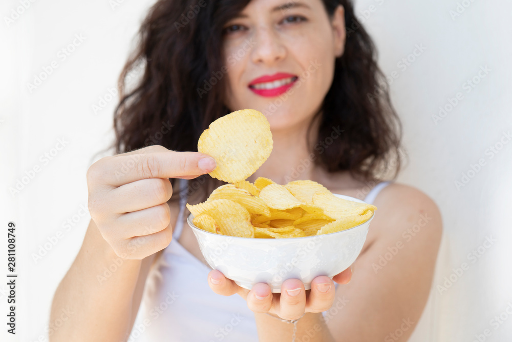 A girl holding the big potato chips bowl. Asking to eating together, Happiness sharing concept. White background.
