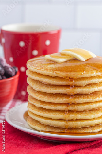 A Stack of Freshly Made Pancakes on a Gingham Tablecloth