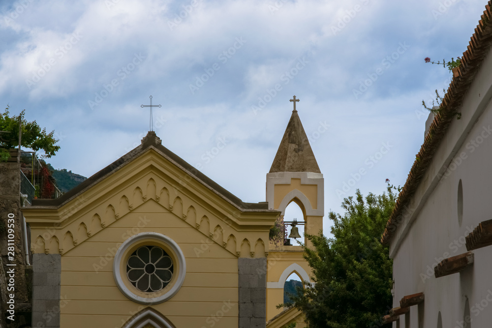 Fototapeta premium Beautiful Church from the Cliffside Village Positano, Province of Salerno, the region of Campania, Amalfi Coast, Costiera Amalfitana, Italy