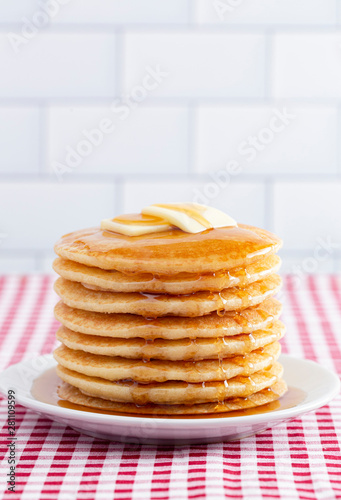 A Stack of Freshly Made Pancakes on a Gingham Tablecloth