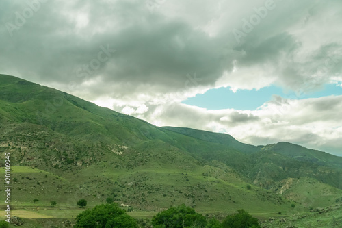 Beautiful view of the mountains landscape near Vardzia, Georgia. Mountains, hills, sky with clouds on a summer day